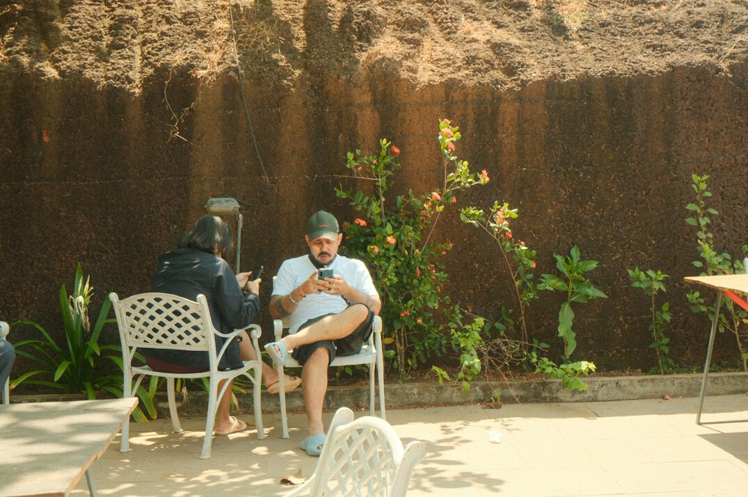 Journalist interviewing a resident outdoors