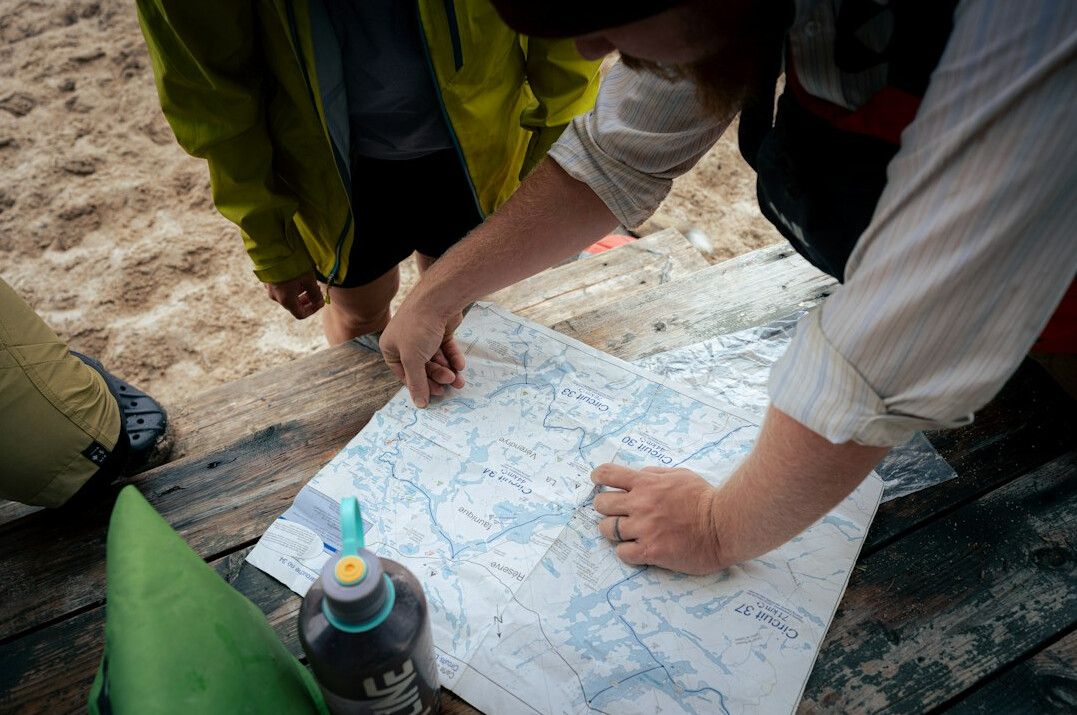investigator examining map